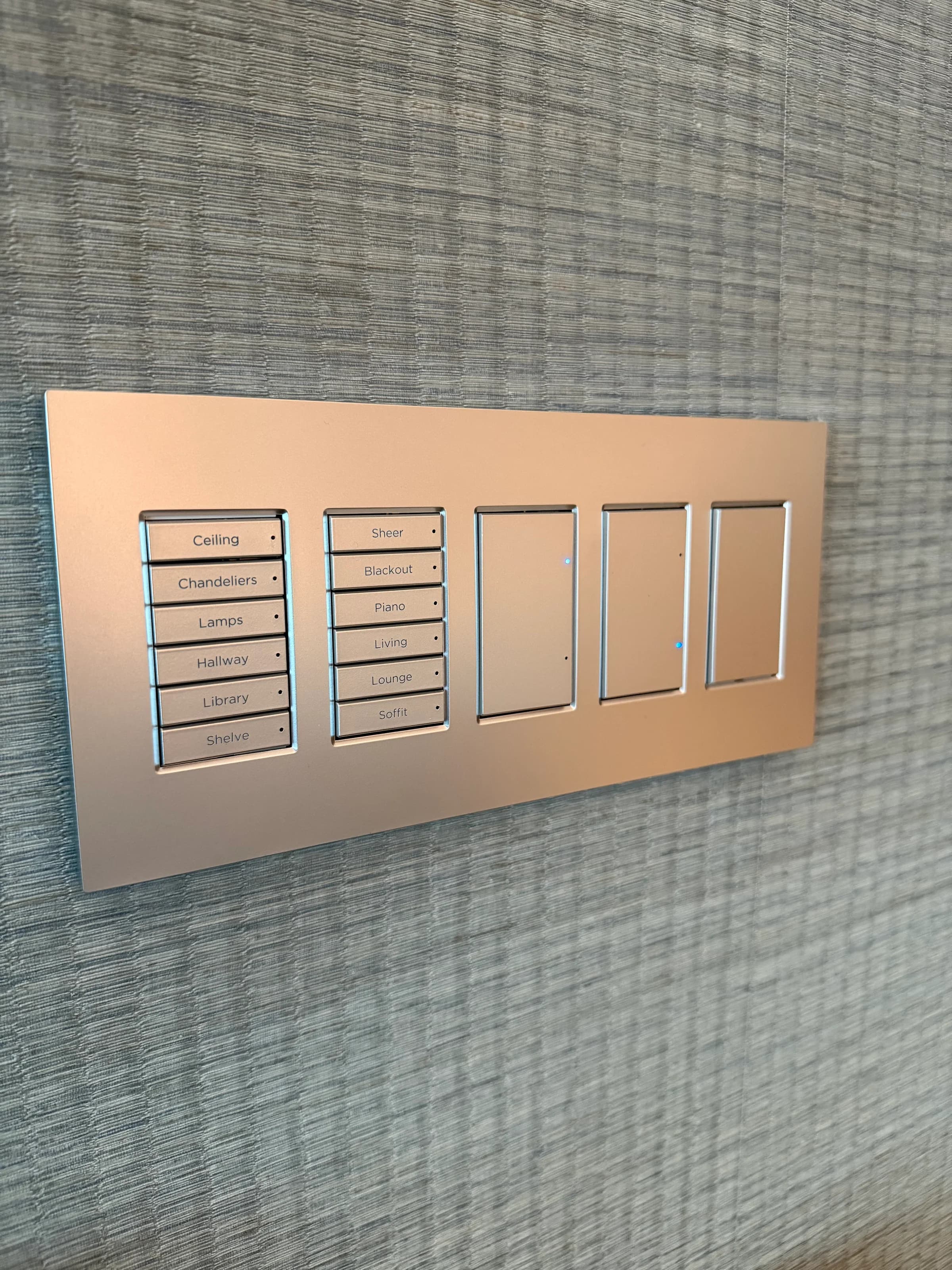 Custom engraved scene control keypad with rose-gold finish and labels for ceiling, chandeliers, lamps, hallway, and library